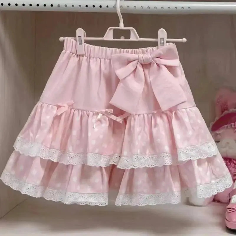 Simples Market Lolita style pink cake skirt with bow and layered lace-trimmed ruffles