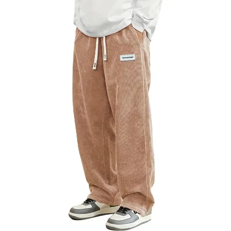 Men's corduroy baggy pants with drawstring elastic waistband in tan, streetwear style