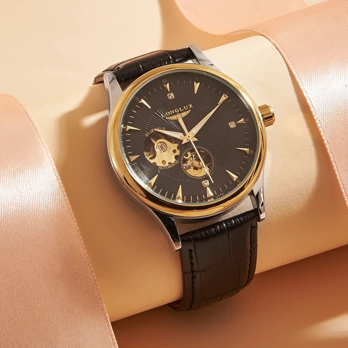 Men's automatic skeleton watch with black dial, gold bezel, and leather strap