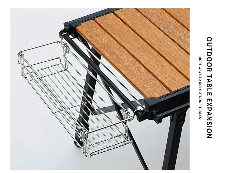 Outdoor table expansion rack with chrome wire basket attached to a folding table by Simples Market