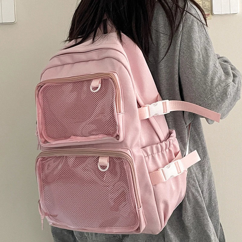 Pink Japanese-Style Transparent Ita Bag Backpack with dual mesh front pockets and large capacity.
