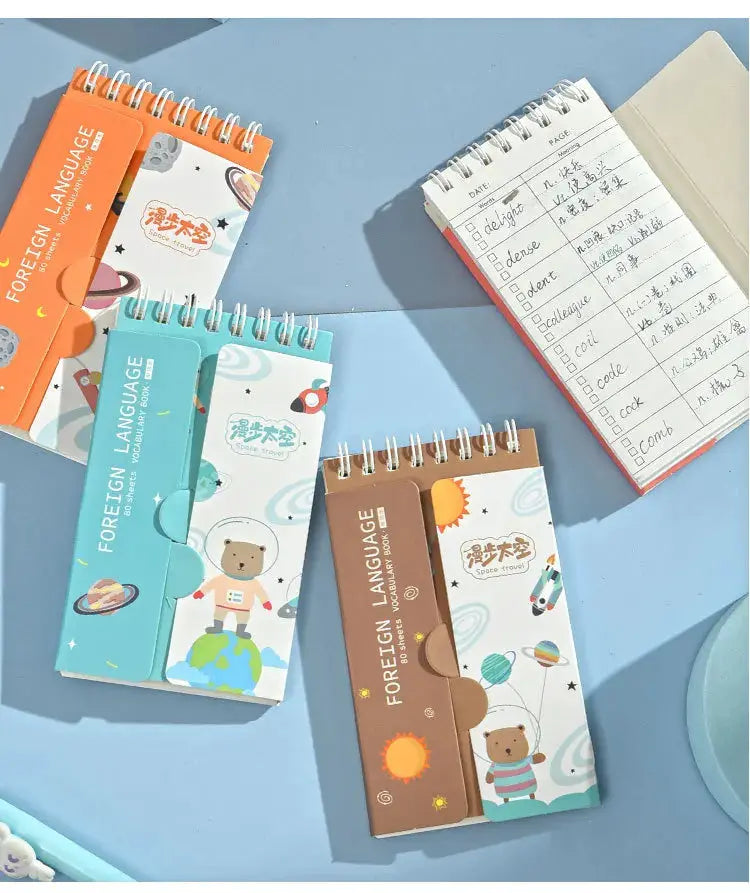 English word notebooks set by Simples Market, 5 portable spiral planners with space covers in orange, turquoise, brown