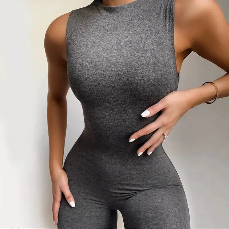 Grey sleeveless pencil jumpsuit for women, form-fitting one-piece activewear in stretch fabric.