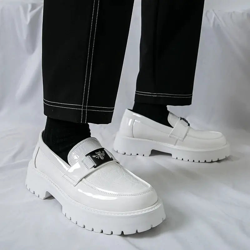Pair of men's white leather slip-on loafers with thick sole and bee logo strap