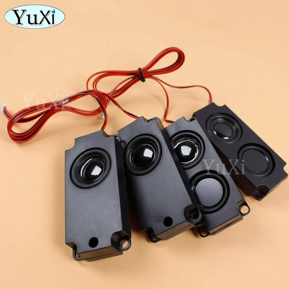 PC speakers by YuXi, four black rectangular units with red wiring