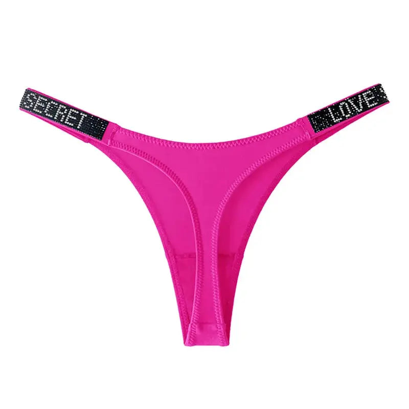 Pink low-waist thong for women with rhinestone letter bands reading SECRET and LOVE on black straps.