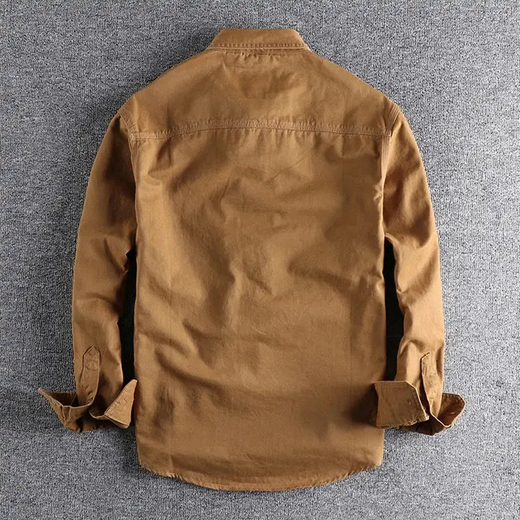 Khaki men's work shirt jacket by Simples Market, loose fit with rolled cuffs.