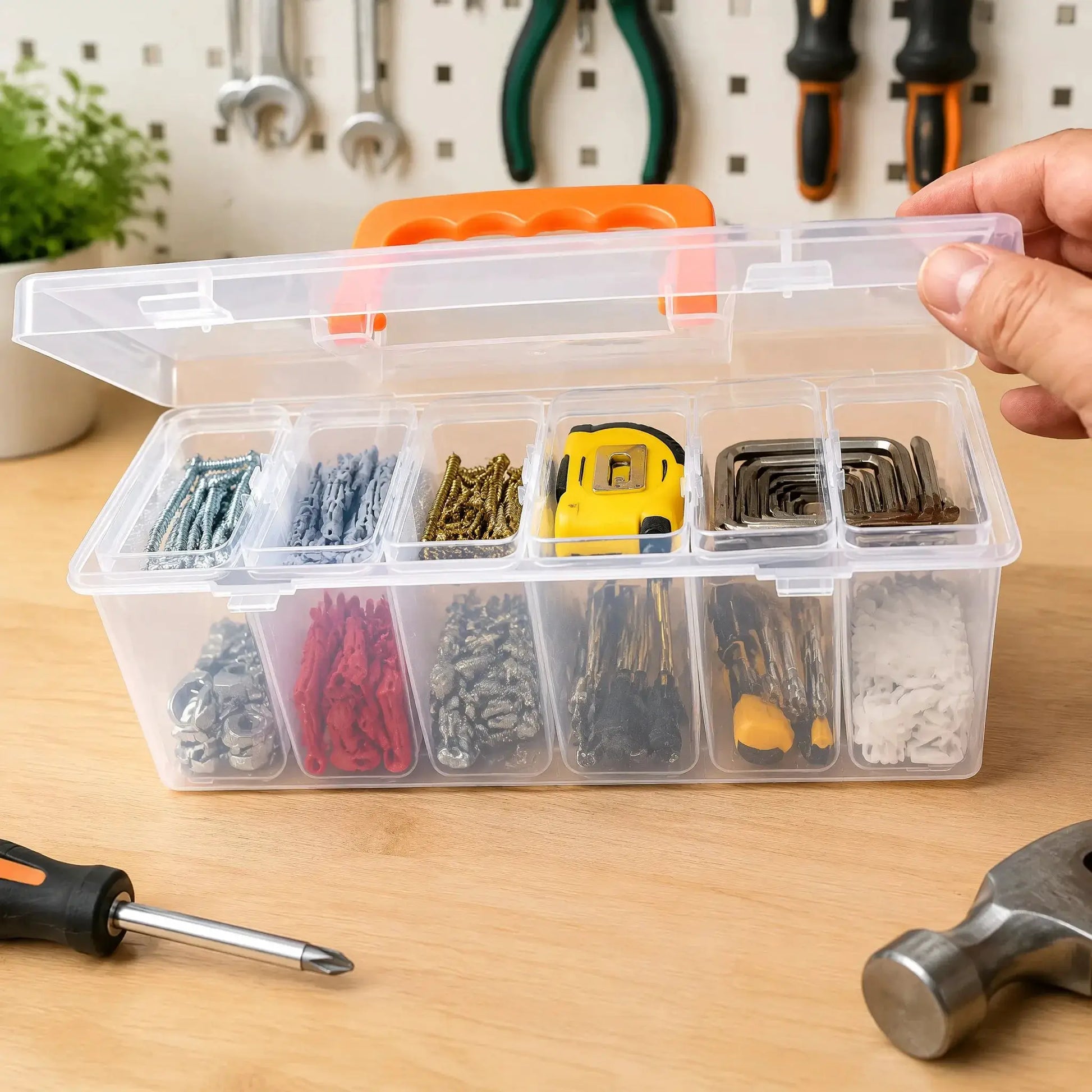 Clear multi-compartment hardware tool storage box with orange latch for organizing screws and accessories