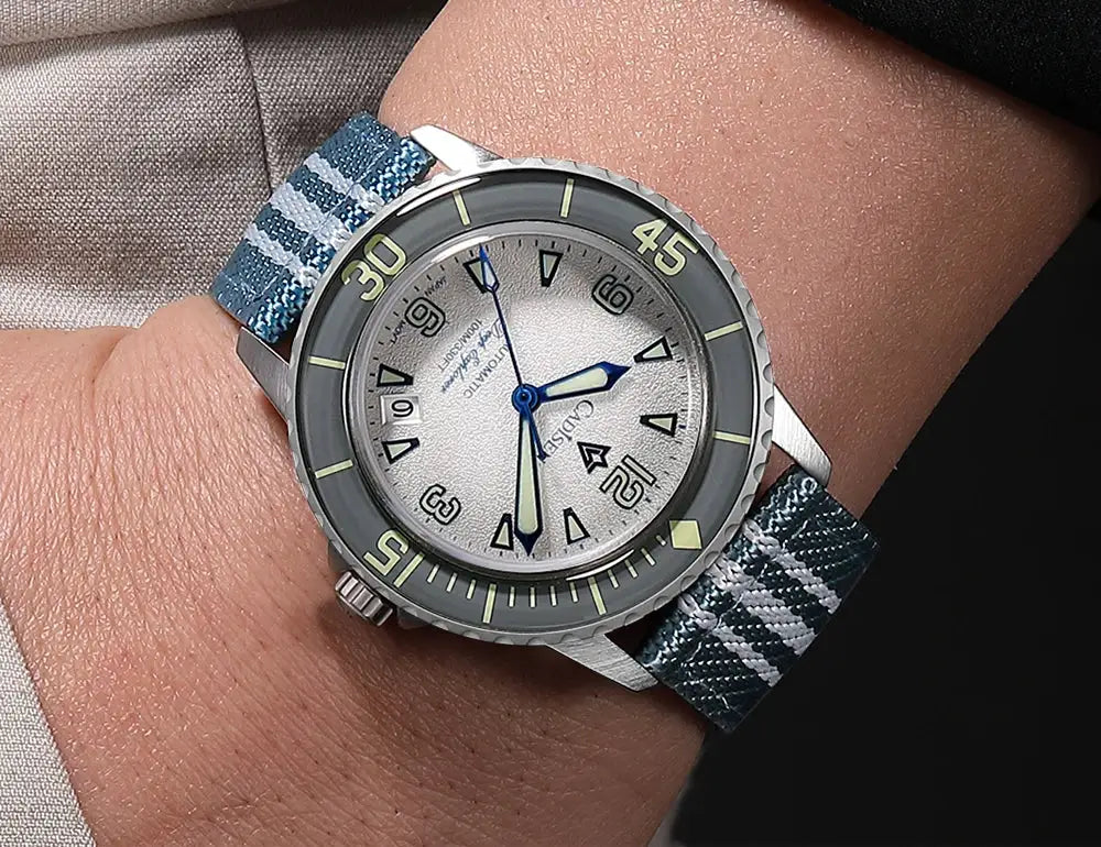 CADISEN Deep Explorer automatic wristwatch with blue plaid canvas strap and silver dial with luminous hands