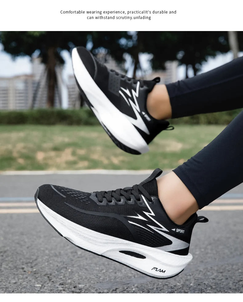 Pair of black breathable running shoes with white cushioned midsole and air cushion