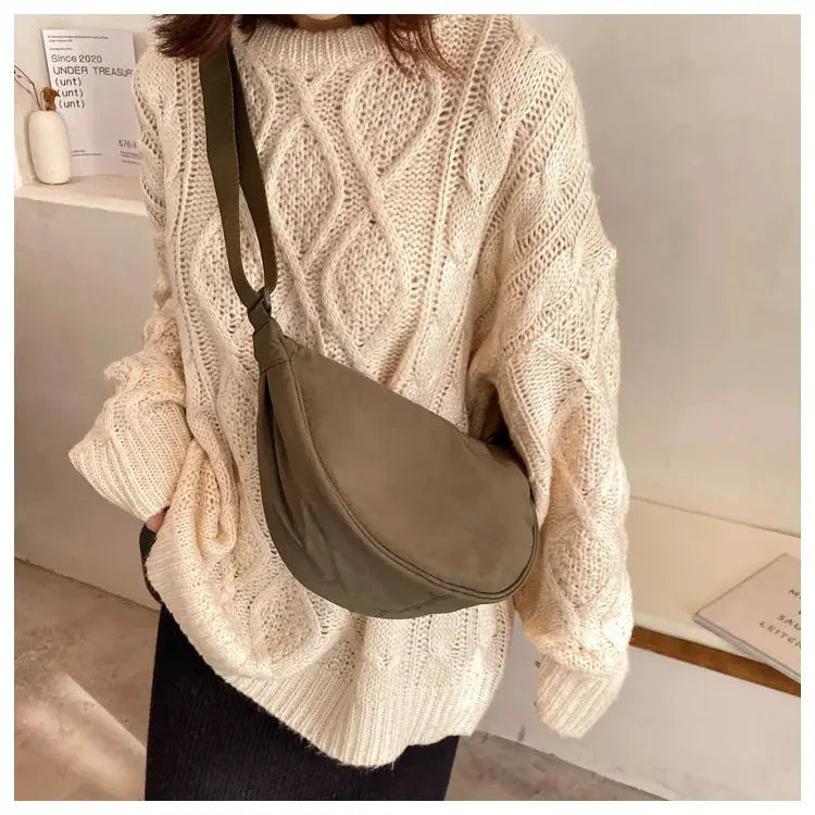 Casual nylon hobo crossbody bag in taupe gray with a long strap.