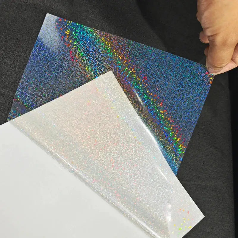 Laminating film sheets with holographic glitter finish; self-adhesive, 4.1x2.9in, Simples Market, 2 sheets shown