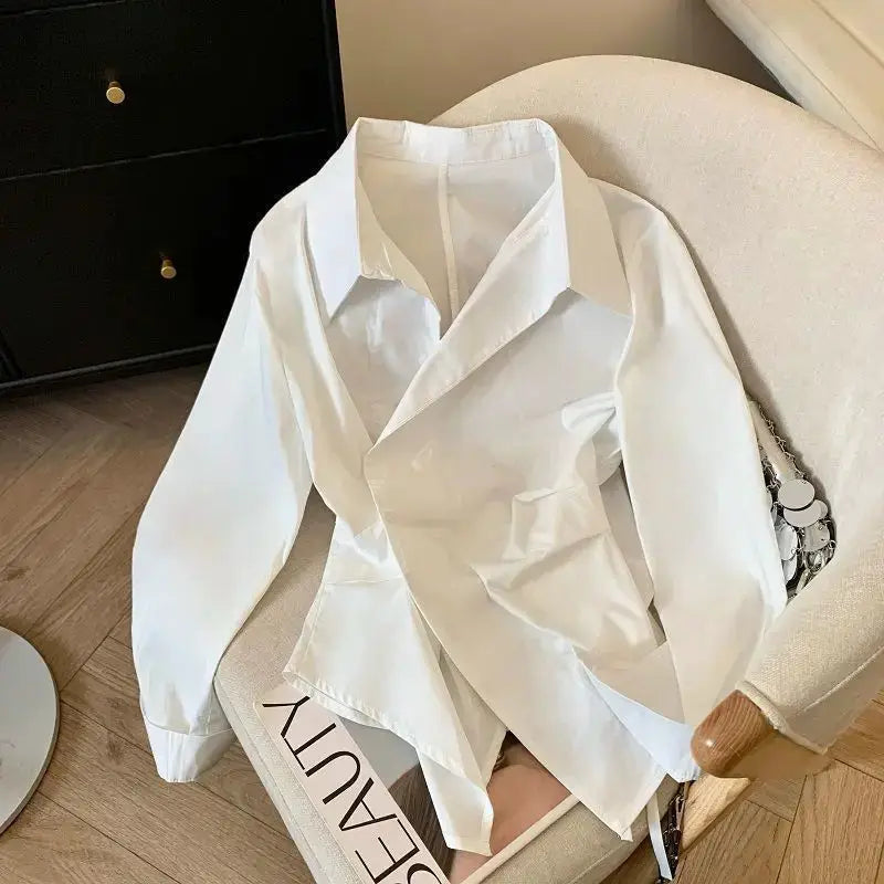 Designer irregular long-sleeve white blouse by Simples Market for women, elegant tunic-style work top.