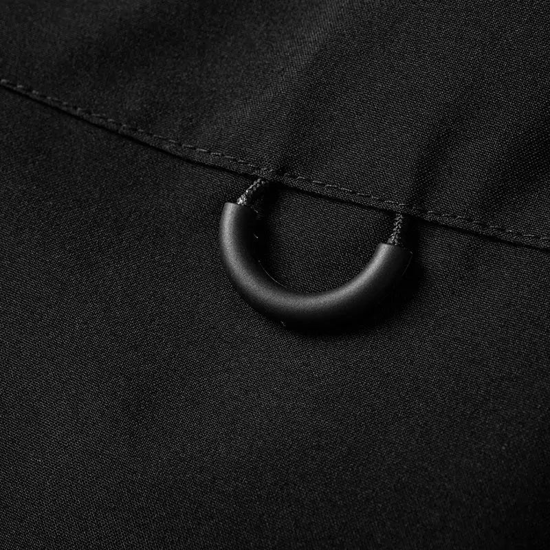 LNGXO waterproof hiking jacket close-up in black fabric with D-ring hardware