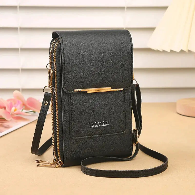 Crazy Bag crossbody phone bag by Simples Market in black faux leather with gold-tone hardware and card holder