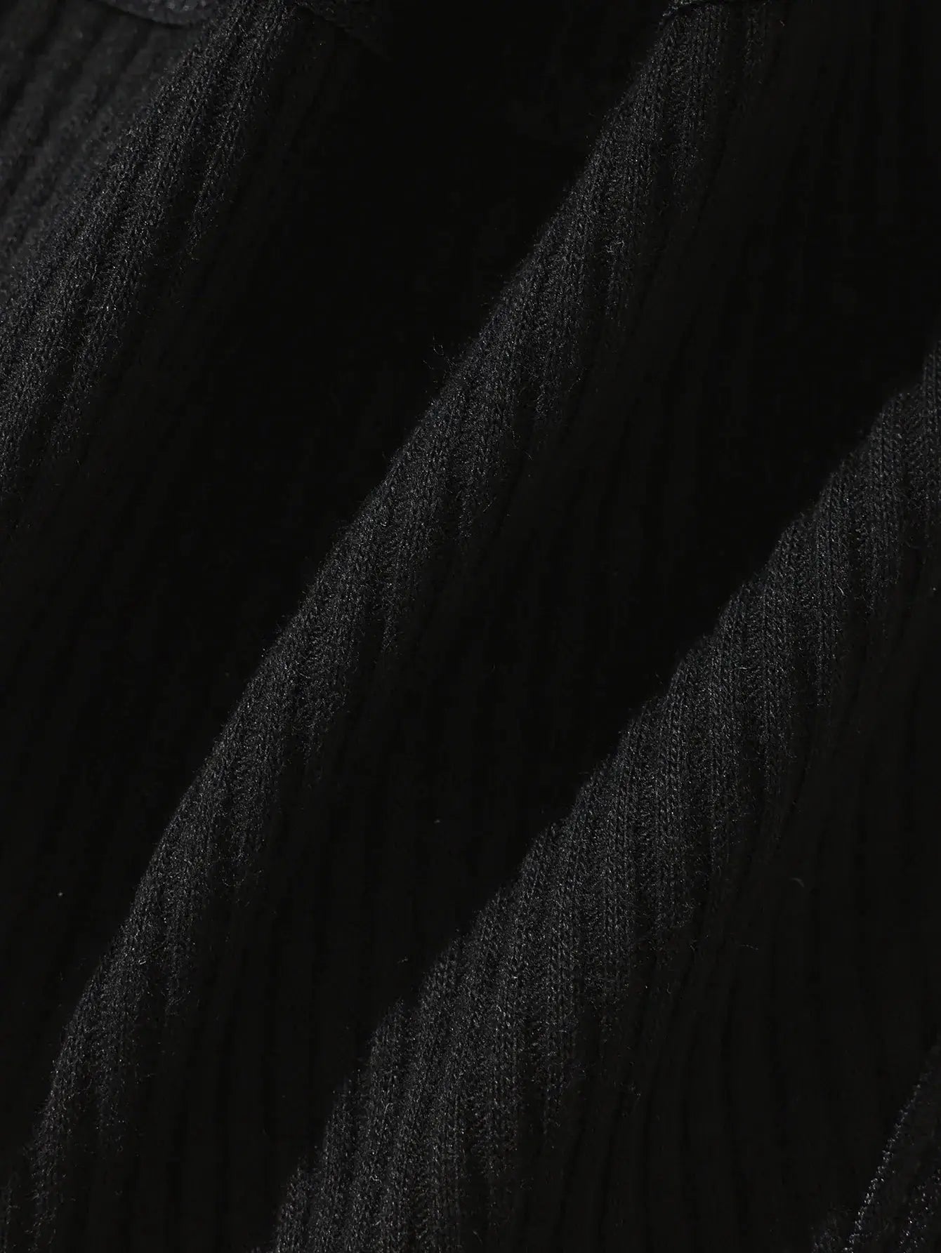 Underwear fabric close-up in black with textured folds