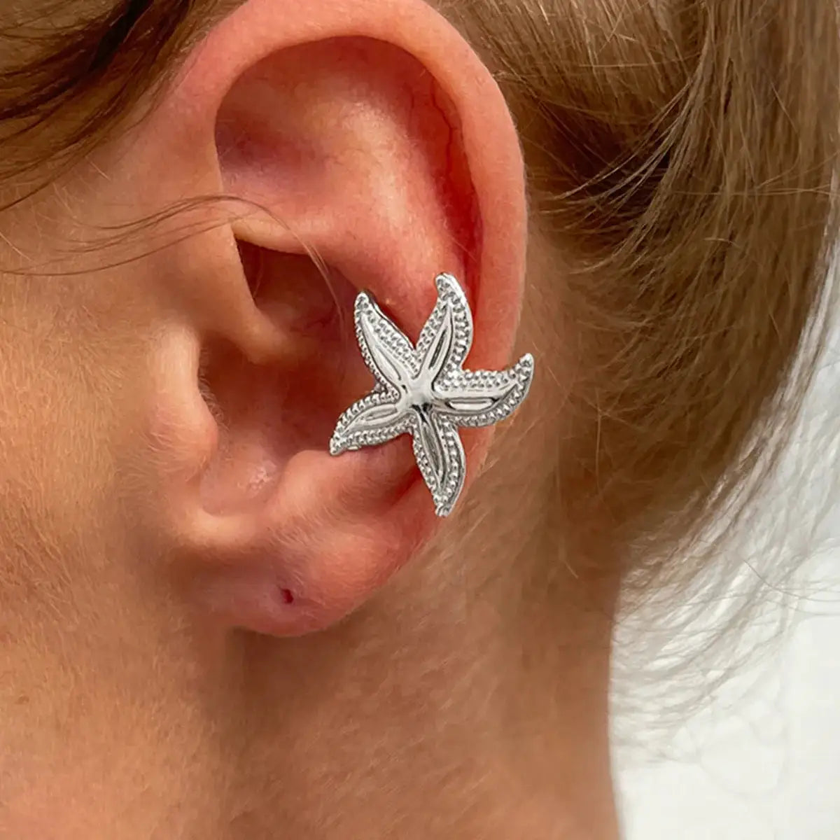Silver-tone starfish ear clip earring for women; boho beach jewelry, fake-piercing style