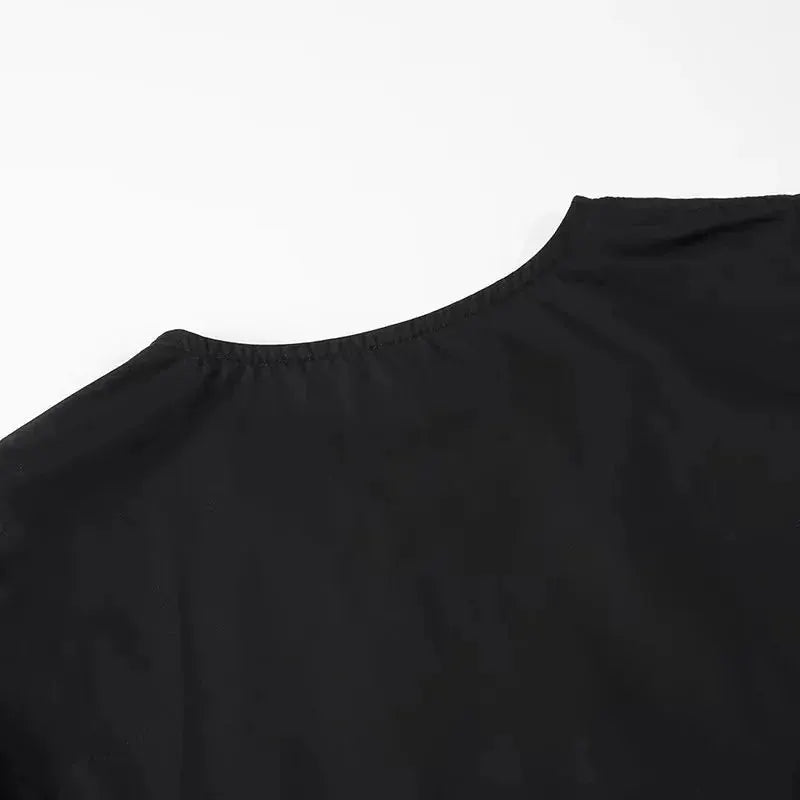 Mujer black blouse with gathered elastic neckline, back view