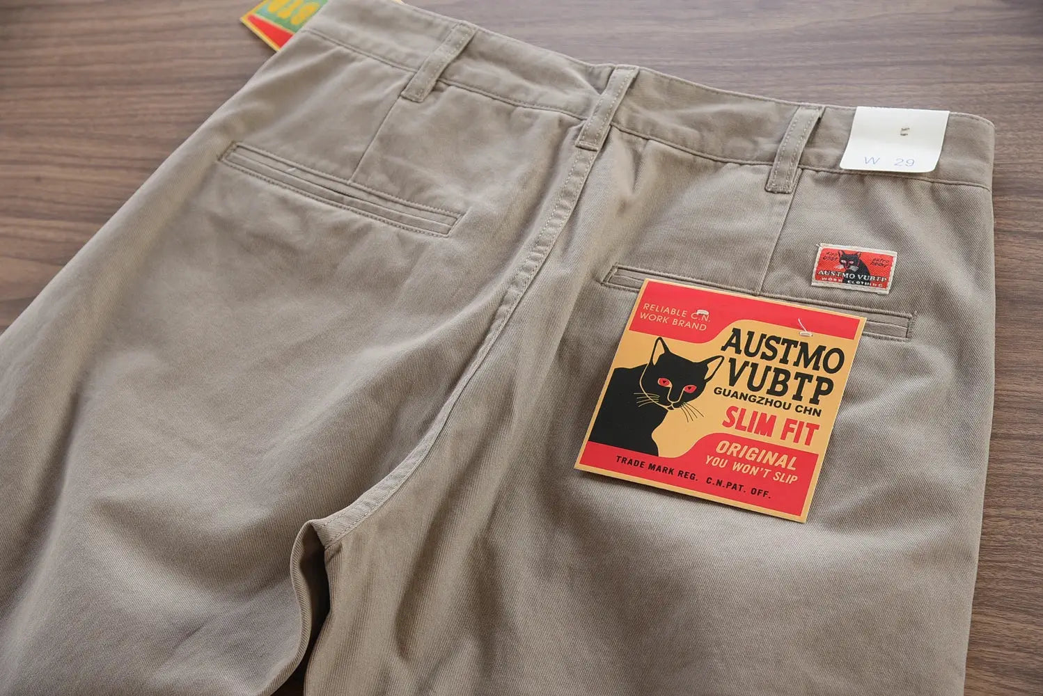 Beige cotton twill chinos back view with welt pockets, AUSTMO VUBTP label, slim fit, size W29.