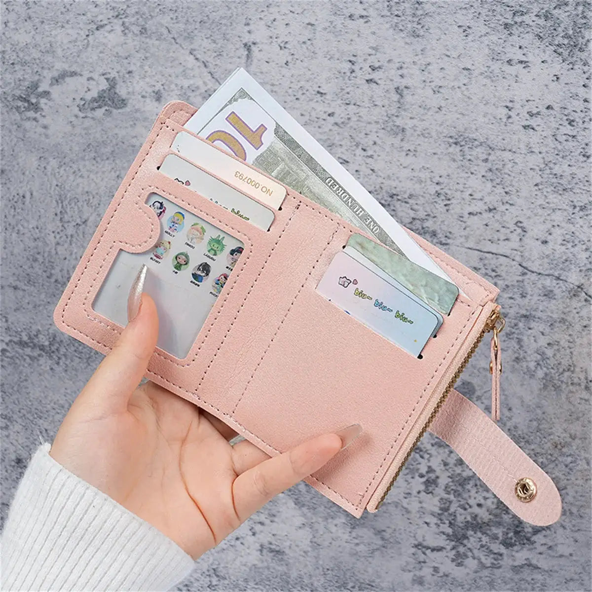 Simples Market pink women's wallet with card slots, transparent ID window, zipper closure, and wrist strap