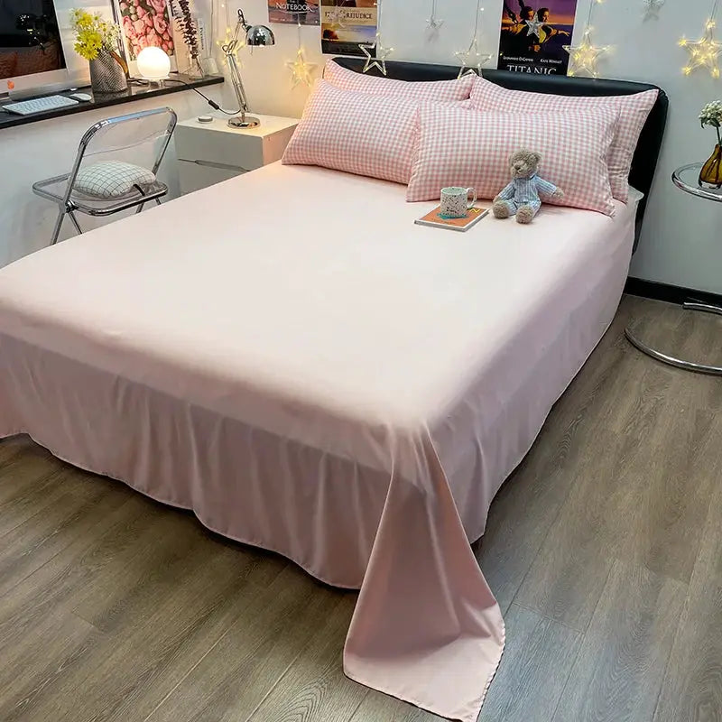 Nordic plaid cotton bedding set with 2 pink plaid pillowcases and a solid pink duvet cover.