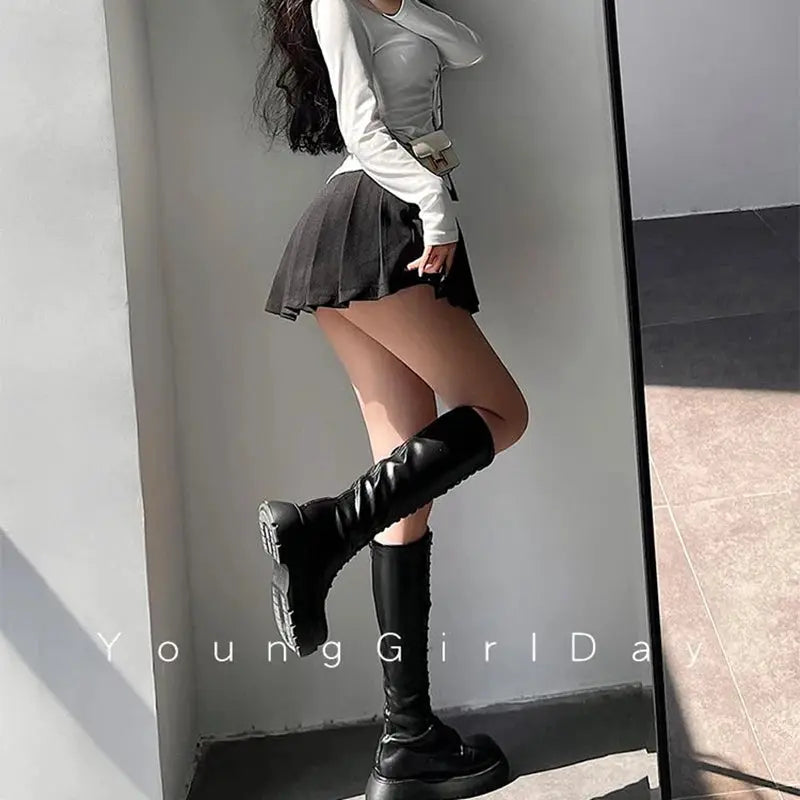 Pleated mini skirt with built-in shorts, high-waist black A-line design