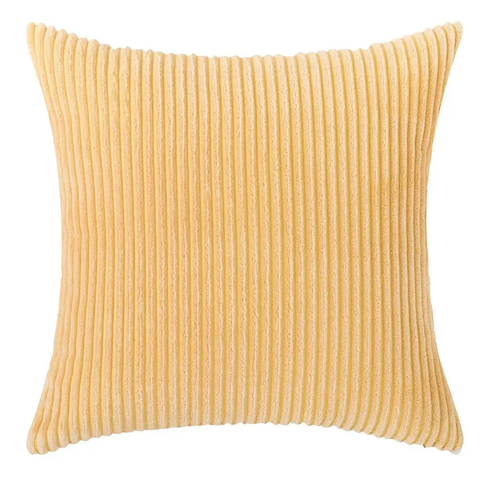 Yellow corduroy pillow cover with vertical ribbing for sofa or bed decor.