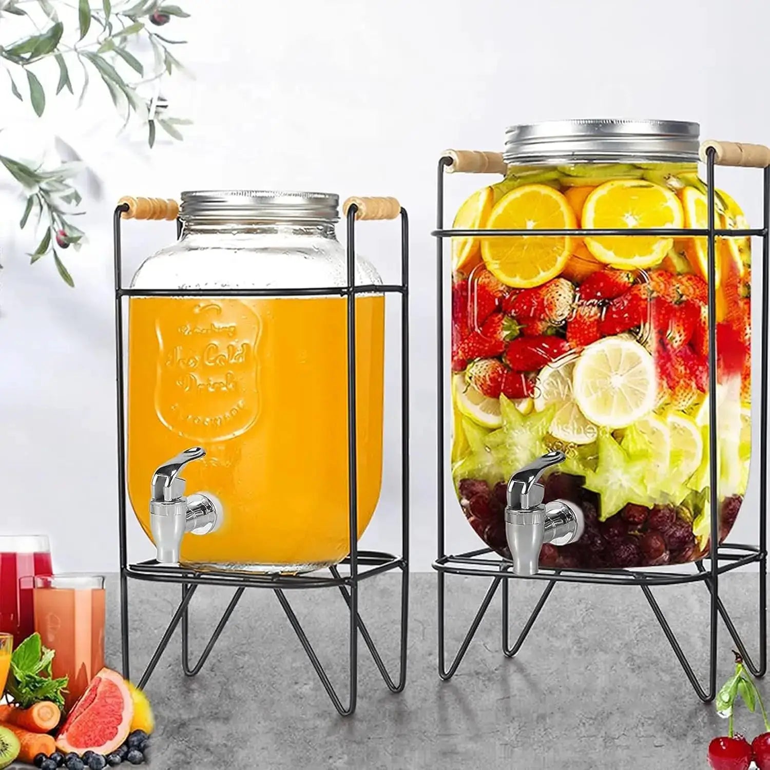 Beverage dispensers; two glass jars on metal stands with taps, juice and fruit-infused mix by Simples Market.