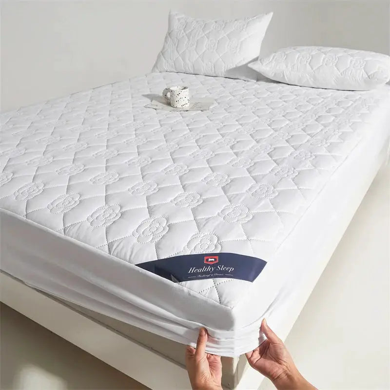 Waterproof mattress protector fitted sheet in white with quilted pattern and deep pockets; Healthy Sleep