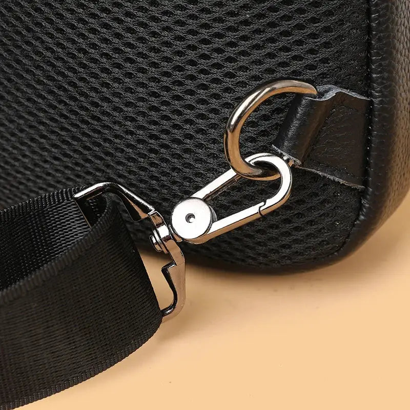Leather men’s chest bag by Simples Market with detachable black strap and silver hardware