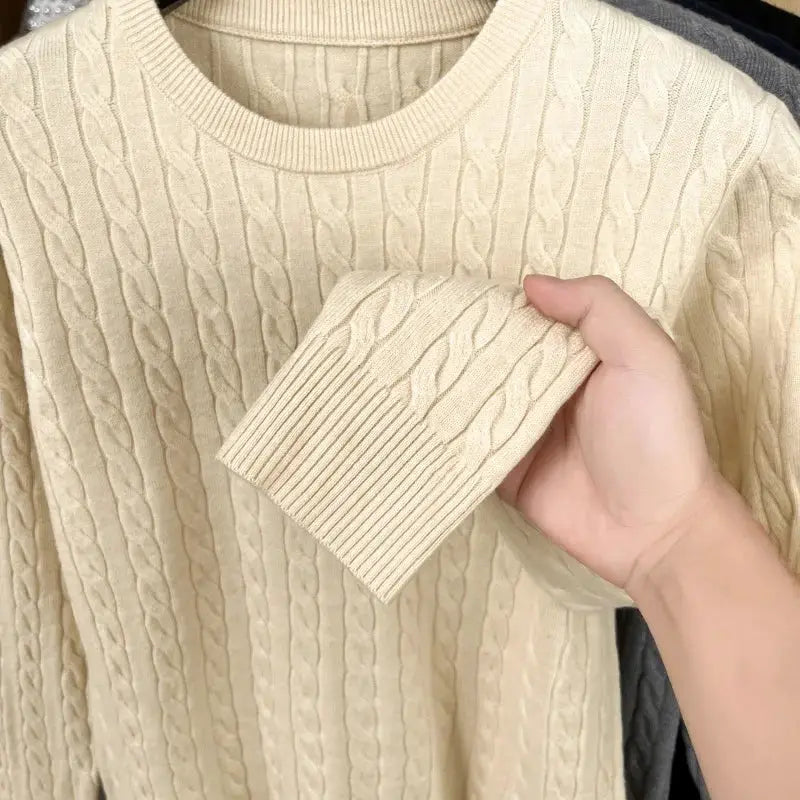 Cream cable-knit crewneck men's sweater; long sleeves with textured knit