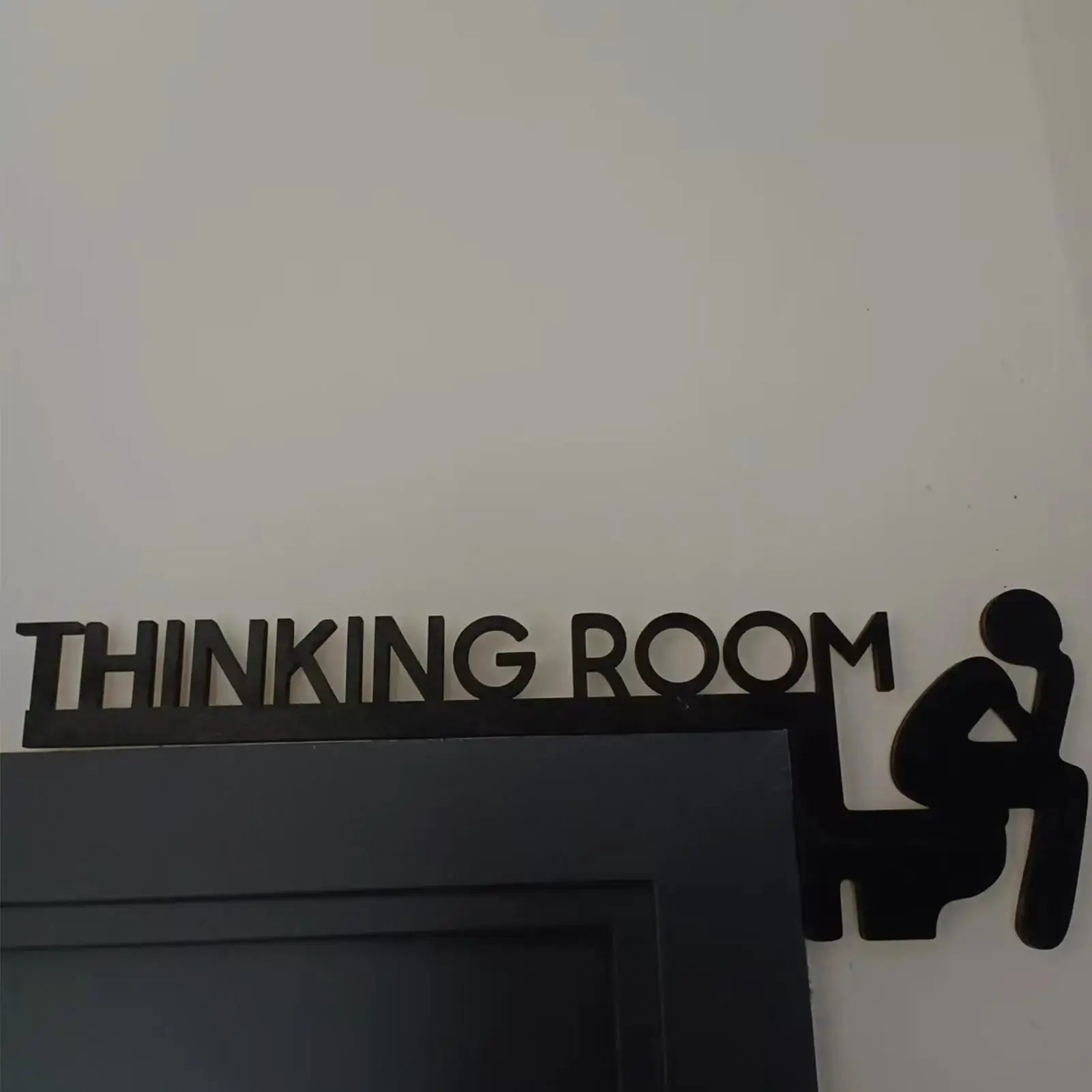 Wood door sign topper with bold THINKING ROOM lettering in black on white, decorative home wall ornament