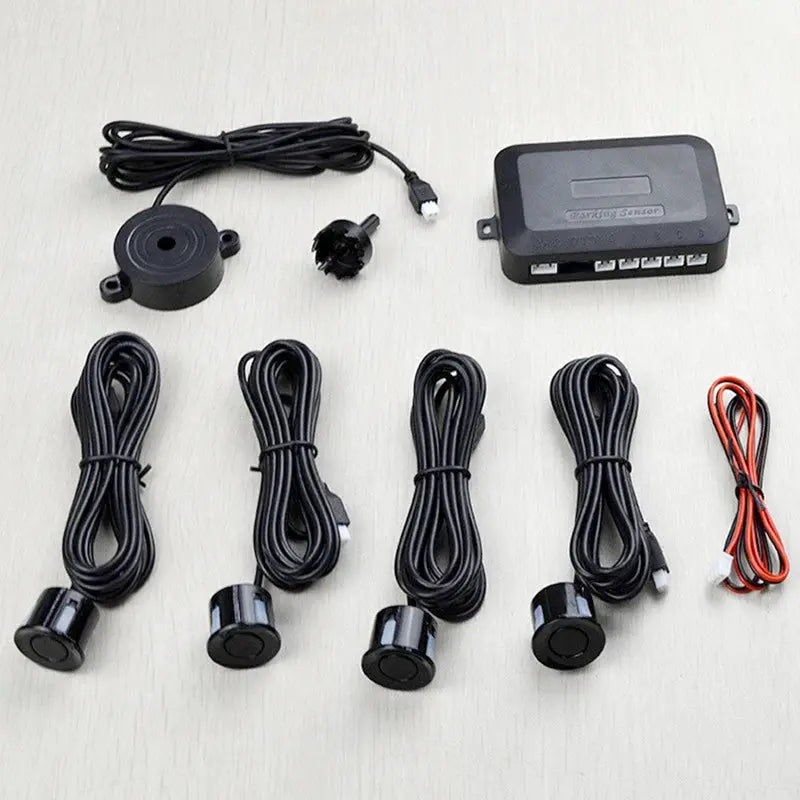 Risingon 12V four-sensor car parking sensor kit by Simples Market, shown with black control unit and wiring harnesses