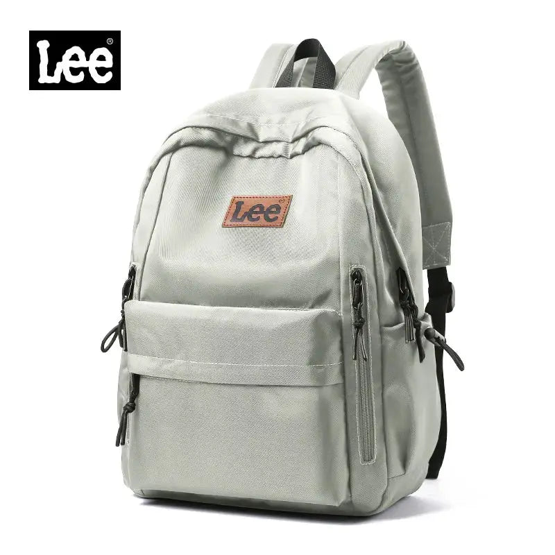Lee lightweight 16-inch laptop backpack in light gray Oxford fabric with front and side zip pockets.