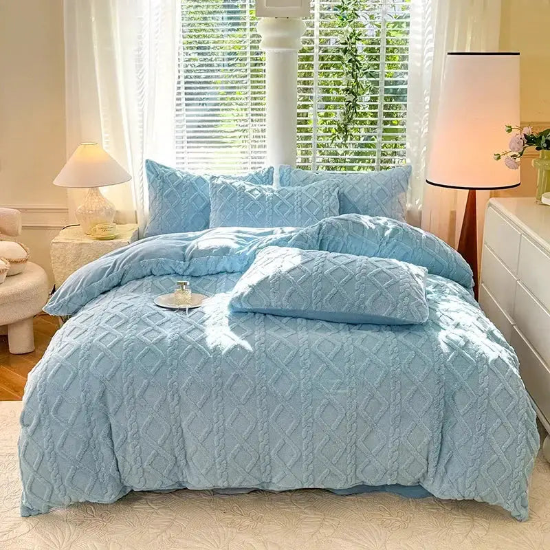Tafuru Milk fleece quilt set by Simples Market in light blue on bed with matching pillows
