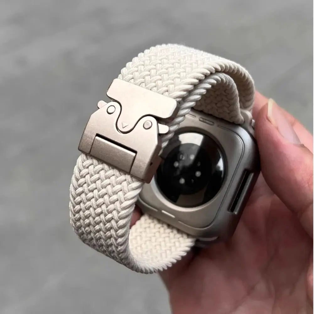 Parachute braided Apple Watch strap in cream nylon with metal deployment clasp; fits 41–49mm Apple Watch models.