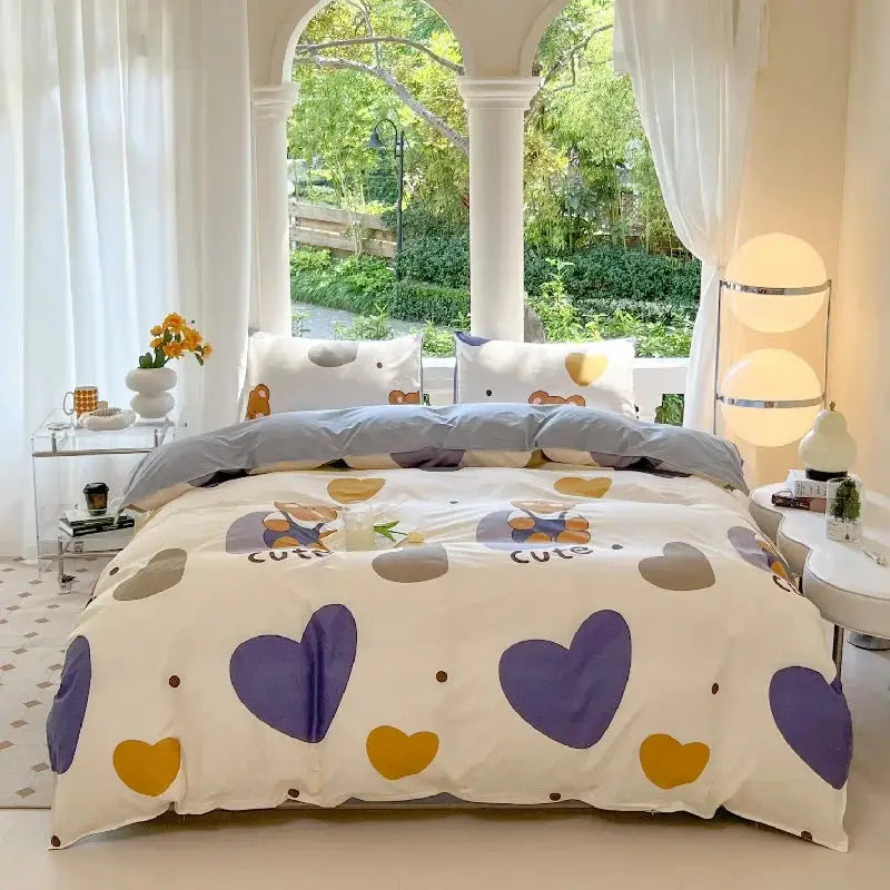 Kawaii bear print bed set with purple and yellow hearts on white duvet; includes duvet cover and pillowcases.