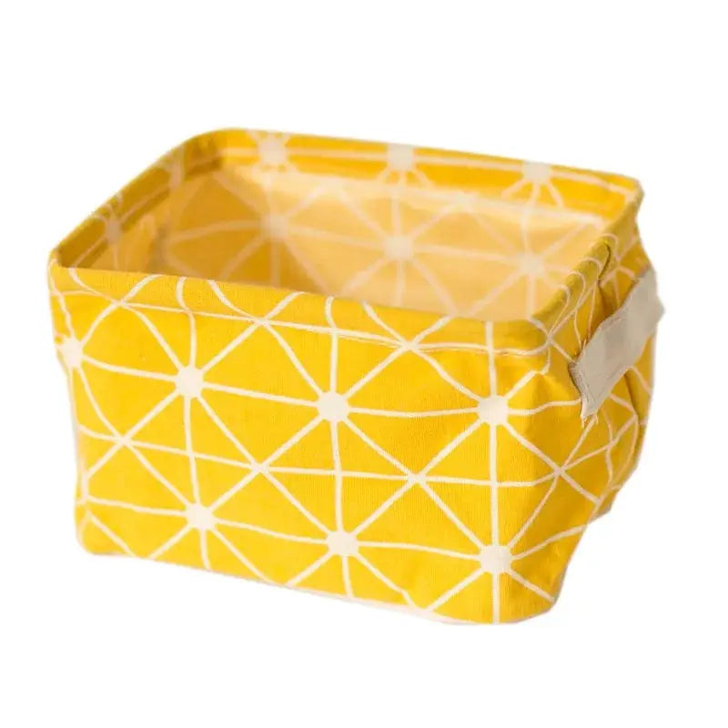 Linen desktop storage basket by Simples Market, yellow with white geometric pattern and side handles