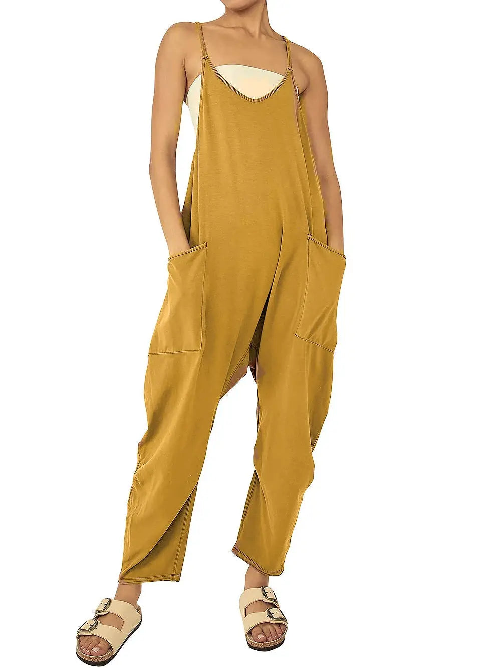 Mustard yellow women's loose-fit jumpsuit with spaghetti straps and large patch pockets