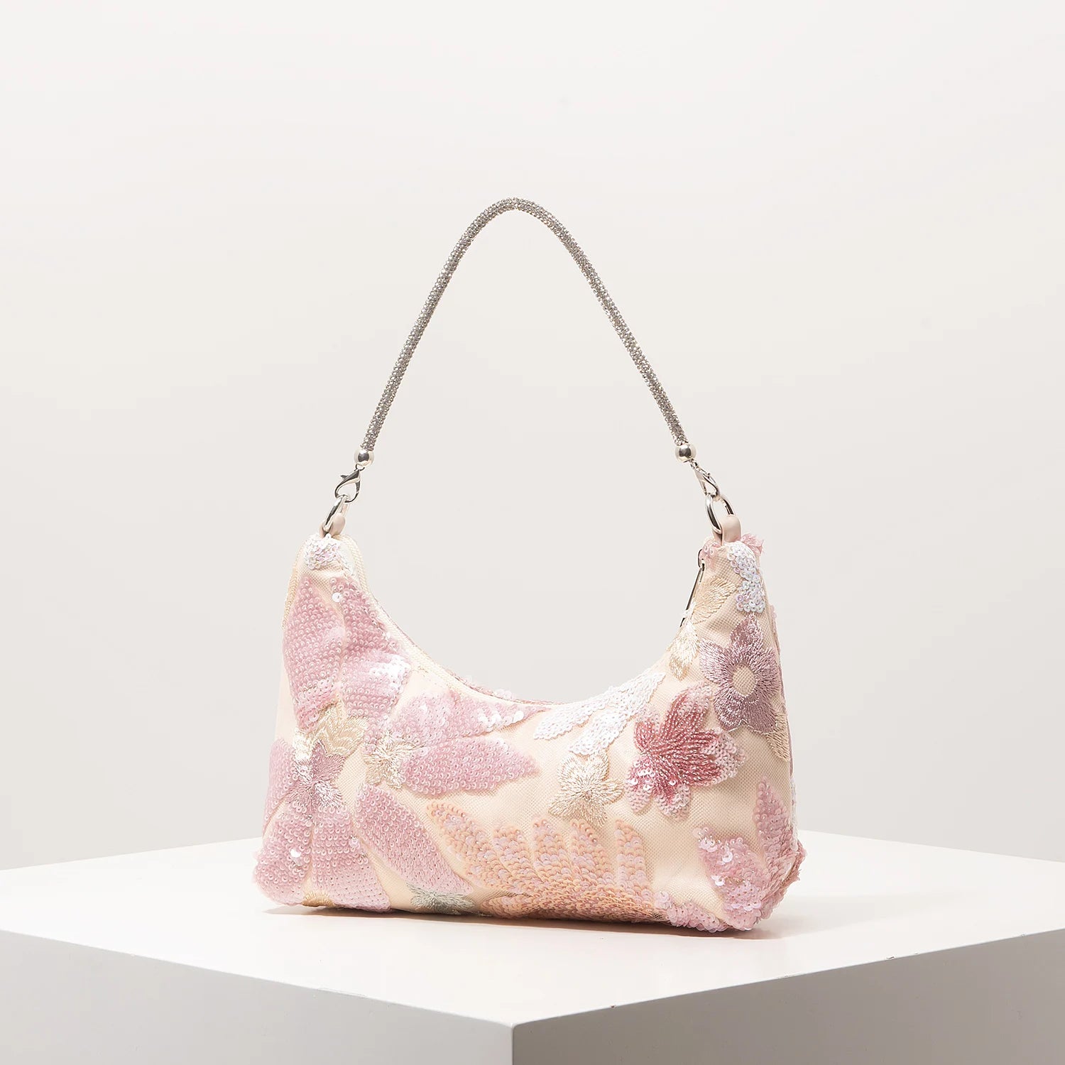 Shoulder bag with pink floral embroidery and sequins, silver chain strap.