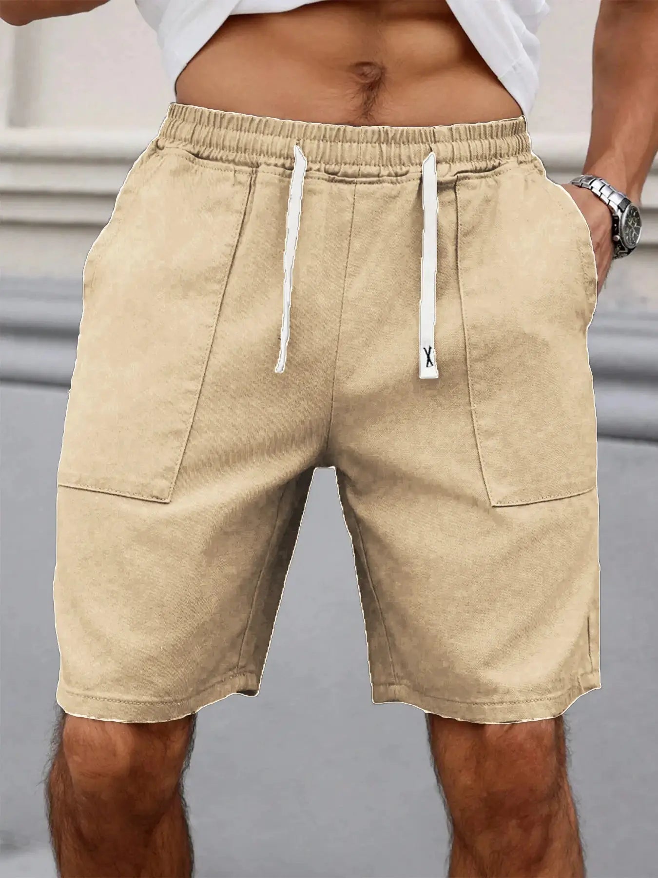 Men's beige mid-length shorts with elastic drawstring waist and side pockets.