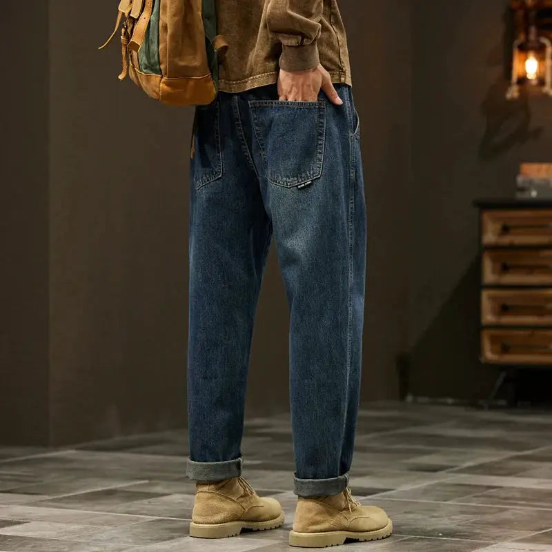 Men's loose-fit denim jeans with baggy harem style, blue denim, rolled cuffs, casual outdoor workwear