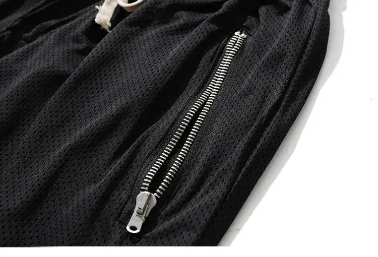 Men's black mesh basketball shorts with zippered side pocket, quick-dry running style
