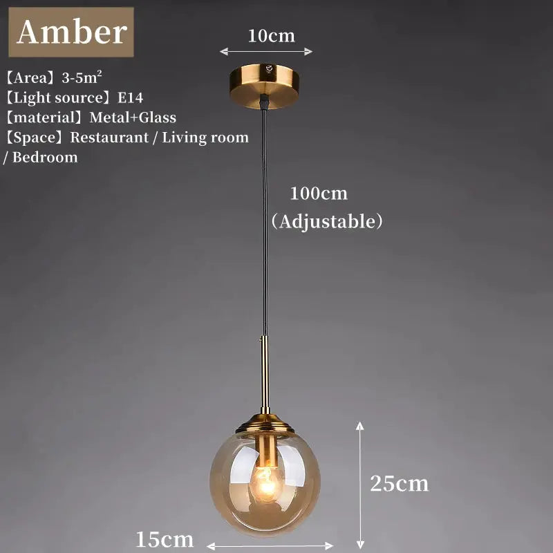 Amber glass pendant lamp by Simples Market with gold metal fitting, adjustable 100 cm cord.