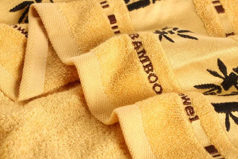 Bamboo fiber towel set in warm yellow, hand 34x74cm and bath 70x140cm towels