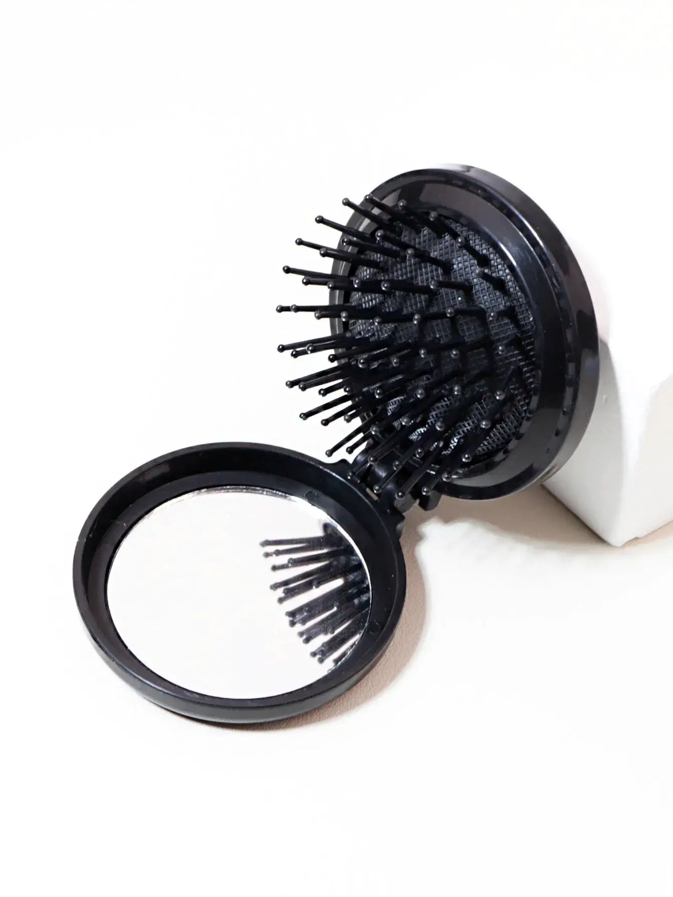 2-piece Simples Market compact hairbrush with mirror; black anti-static bristles, travel-ready