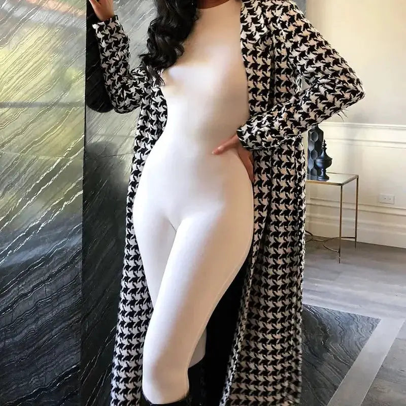 White long-sleeve bodysuit by Simples Market with a black-and-white houndstooth long coat