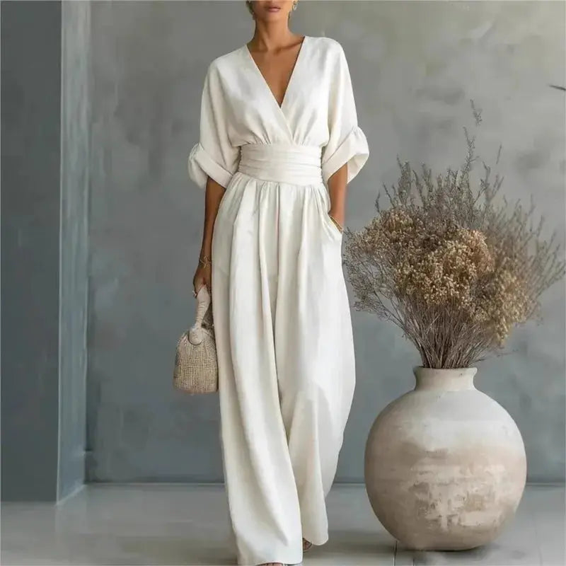 Waist V-neck jumpsuit in cream with mid-sleeve, wide-leg silhouette and waist belt.