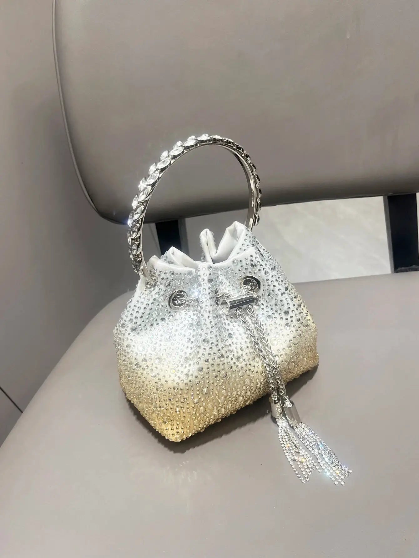 Simples Market white rhinestone evening clutch bag with crystal-embellished surface, round ring handle and tassel