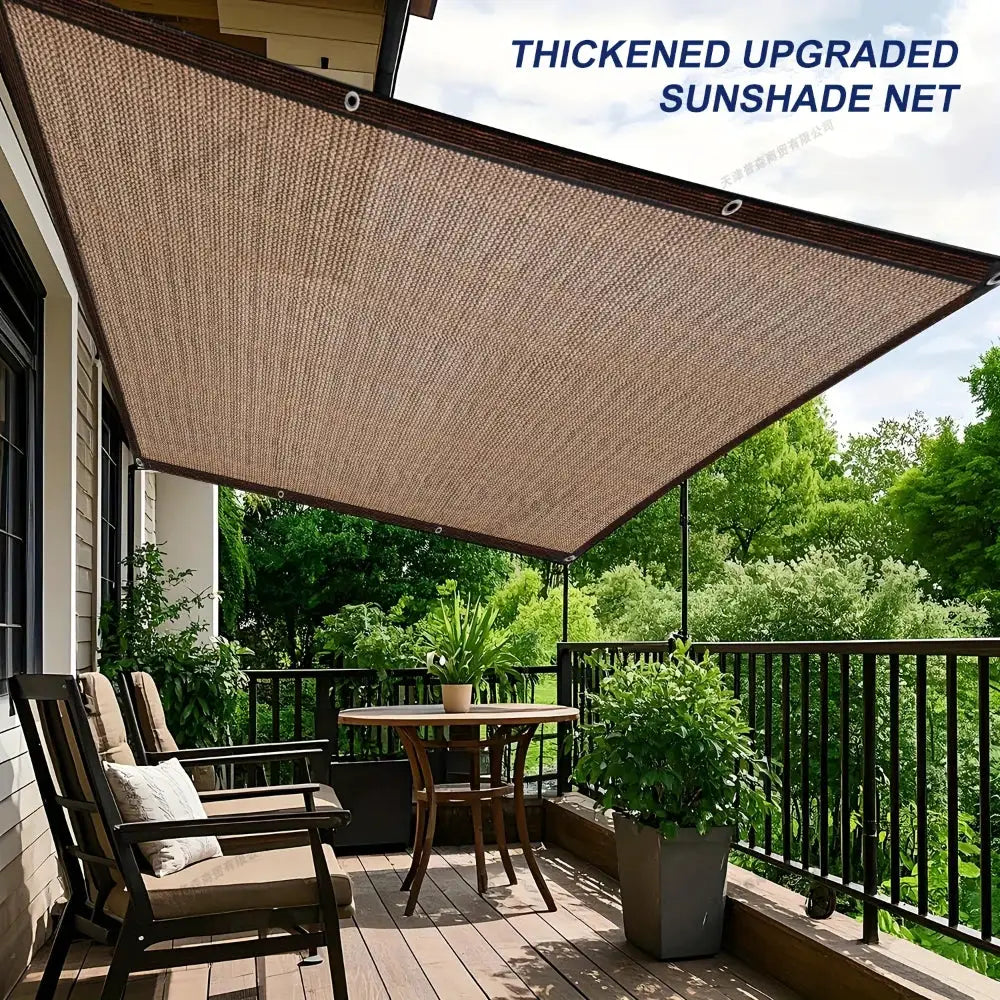 Shade cloth with grommets; thickened sunshade net in brown-beige over a patio balcony.